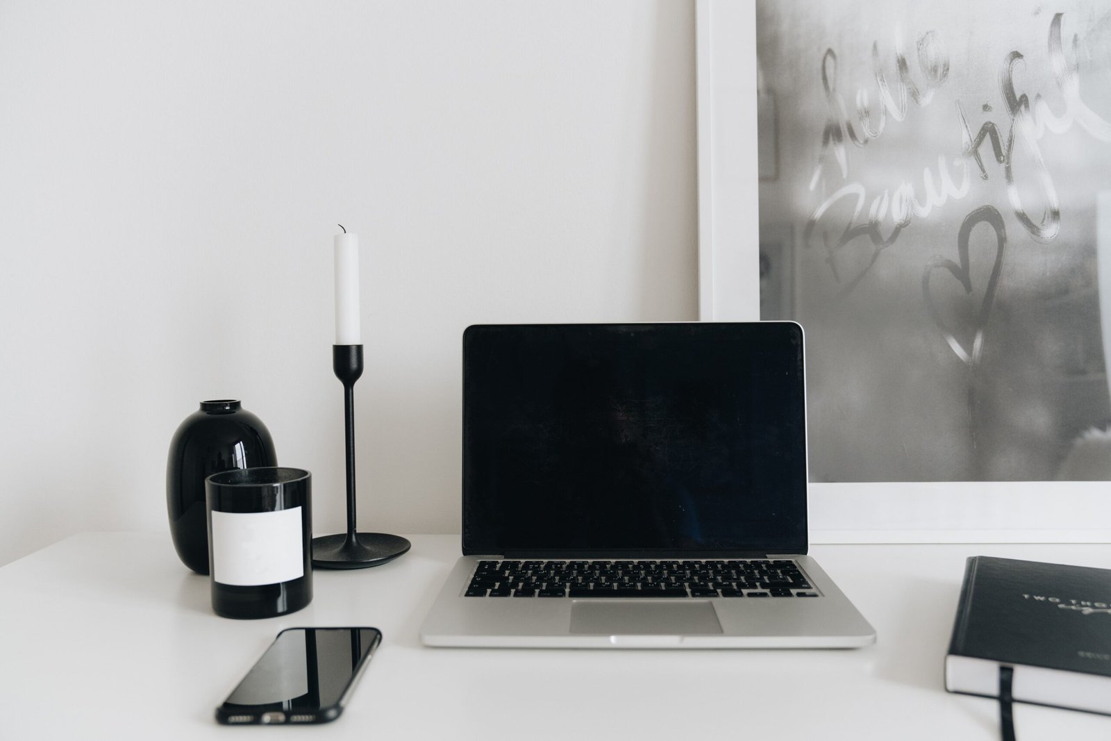 Laptop and phone on a desk representing generative engine optimization (GEO) for AI search